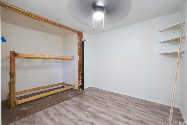 empty room featuring light wood-type flooring and ceiling fan