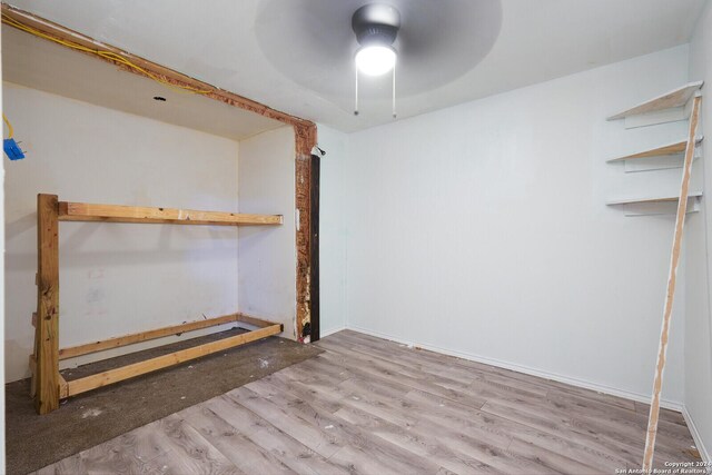 23238 Copper Canyon Dr, Elmendorf, TX 78112 - below grade area featuring ceiling fan and wood finished floors