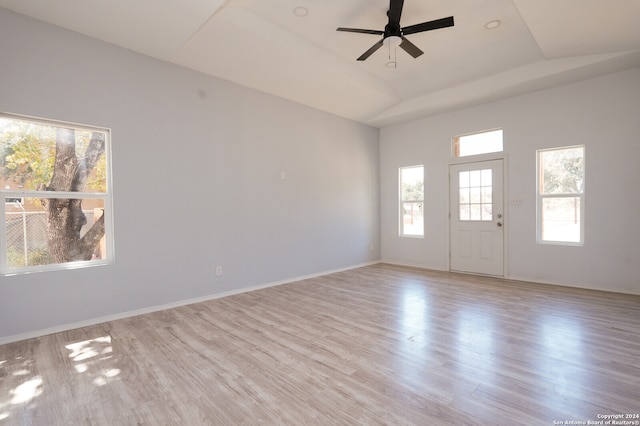 interior space featuring ceiling fan, lofted ceiling, and light wood-type flooring