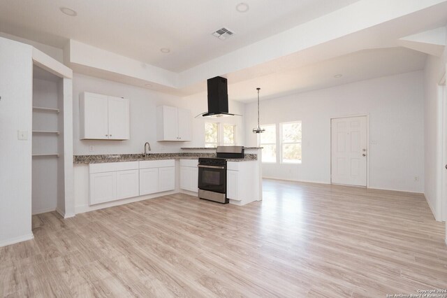 23238 Copper Canyon Dr, Elmendorf, TX 78112 - kitchen with light stone counters, exhaust hood, light wood-style floors, stainless steel range oven, and white cabinetry