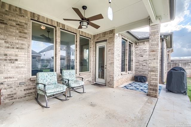 view of patio featuring ceiling fan