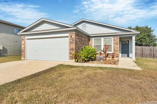 ranch-style home with a front lawn and a garage