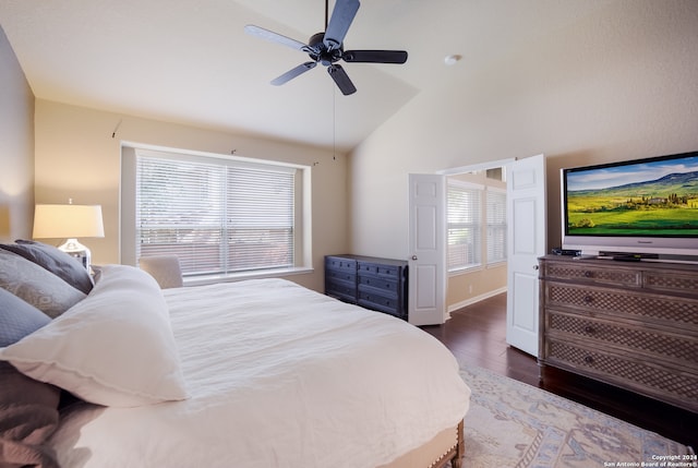 bedroom with lofted ceiling, dark wood-type flooring, and ceiling fan