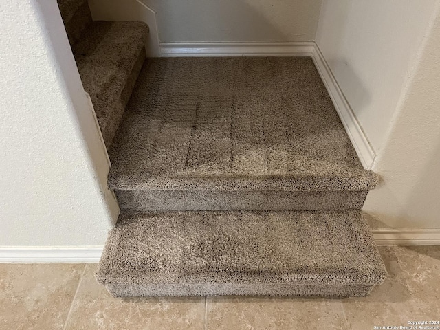 6614 Mia Way, San Antonio, TX 78233 - stairs with baseboards