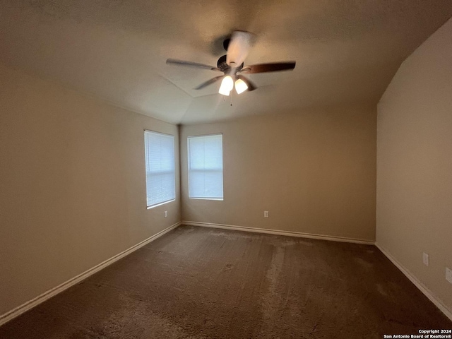6614 Mia Way, San Antonio, TX 78233 - unfurnished room with dark carpet, ceiling fan, and baseboards