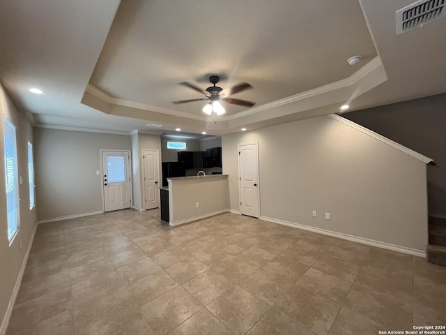 6614 Mia Way, San Antonio, TX 78233 - unfurnished living room with a raised ceiling, ornamental molding, a ceiling fan, baseboards, and recessed lighting