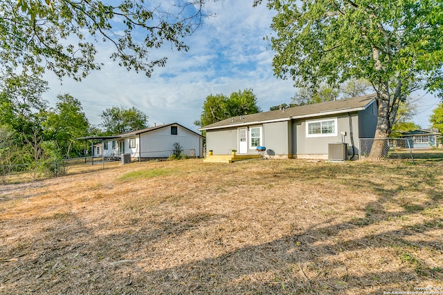 rear view of property featuring central air condition unit