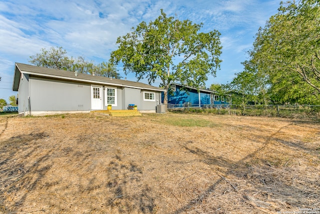 back of property featuring central air condition unit