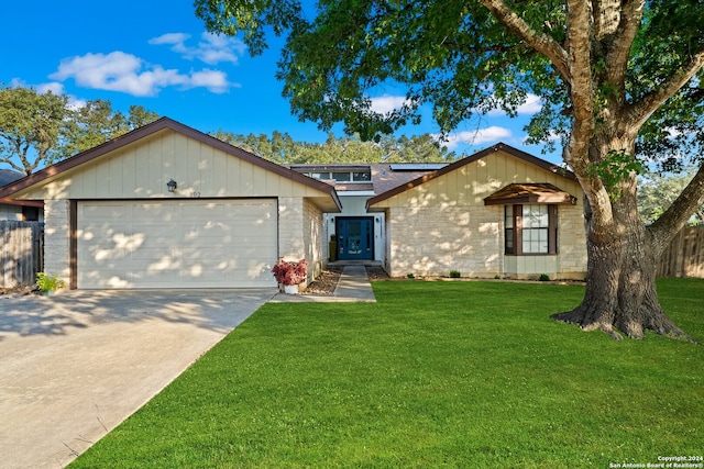 single story home with a front lawn and a garage