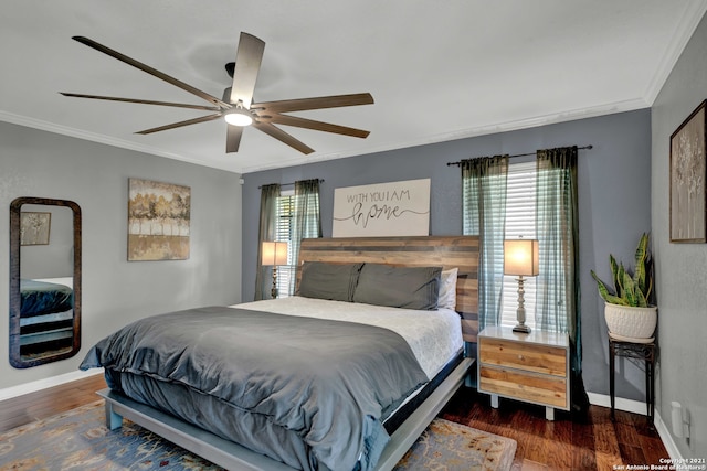 bedroom with ornamental molding, dark hardwood / wood-style floors, and ceiling fan