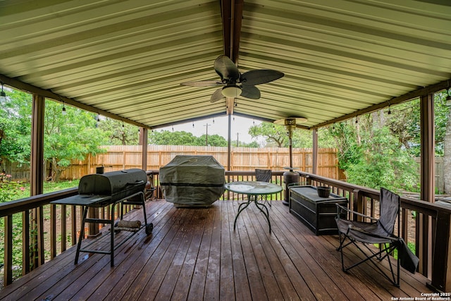 deck with area for grilling and ceiling fan