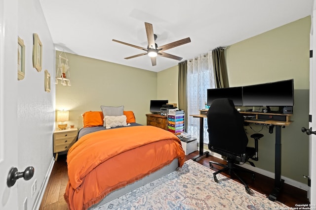 bedroom featuring ceiling fan and hardwood / wood-style flooring