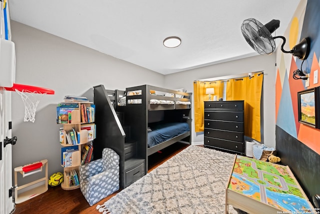 bedroom with dark hardwood / wood-style flooring