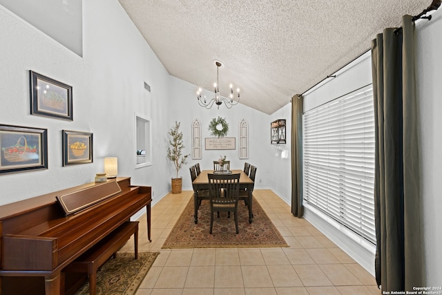 dining area with a notable chandelier, a textured ceiling, lofted ceiling, and light tile patterned flooring