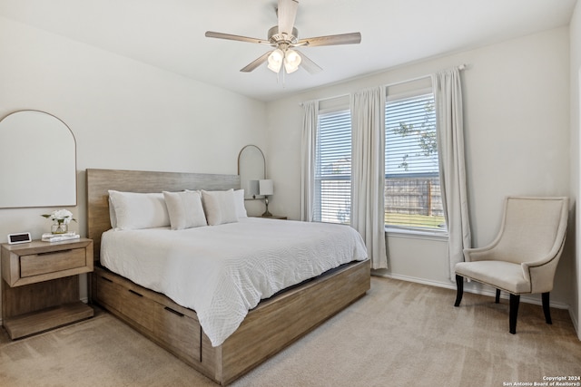 carpeted bedroom featuring ceiling fan