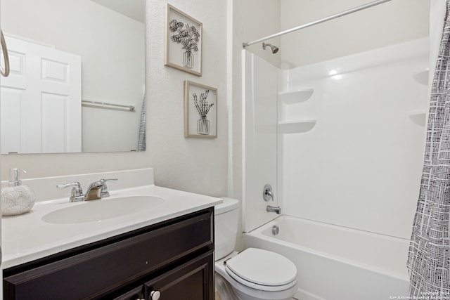 full bathroom featuring vanity, shower / bath combo, and toilet