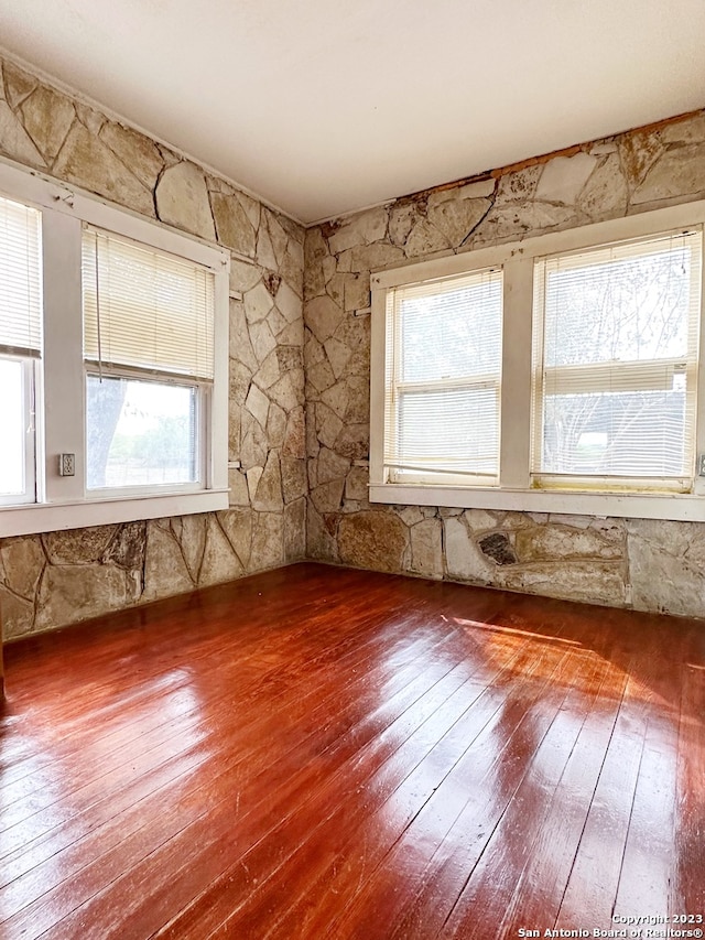 spare room with wood-type flooring