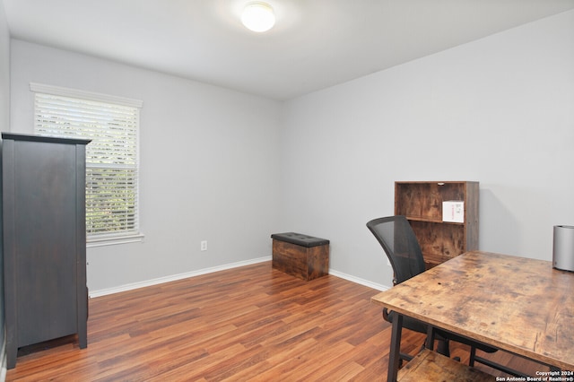 office with hardwood / wood-style flooring