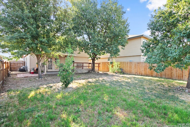 view of yard with french doors