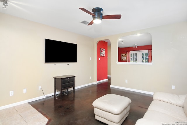 living room with concrete floors and ceiling fan