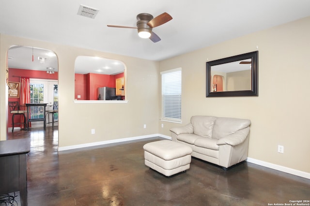 living area with ceiling fan