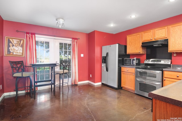 kitchen featuring ventilation hood and stainless steel appliances