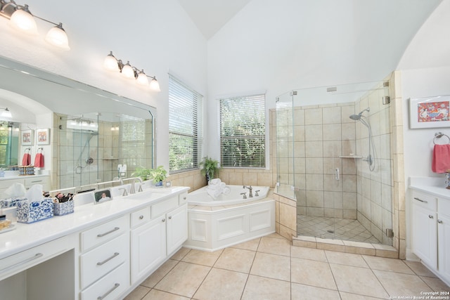 bathroom with vanity, lofted ceiling, plus walk in shower, and tile patterned flooring