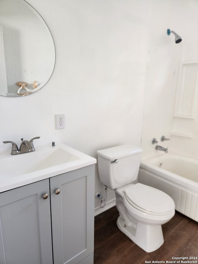 full bathroom with vanity, toilet, hardwood / wood-style flooring, and shower / bath combination