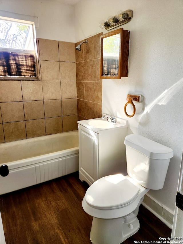 full bathroom with toilet, vanity, bathing tub / shower combination, and wood finished floors