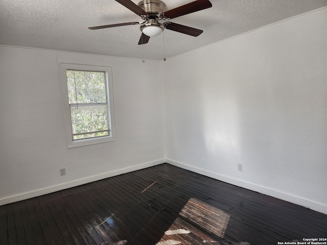 empty room featuring a textured ceiling, wood-type flooring, and ceiling fan