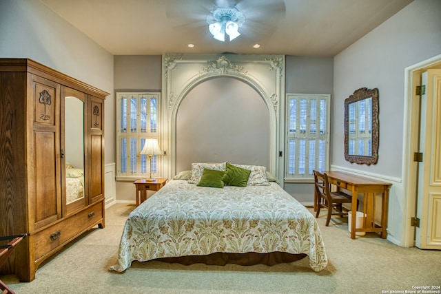 bedroom with light colored carpet and ceiling fan