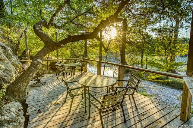 wooden deck with a water view