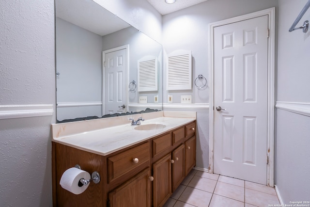 bathroom with vanity and tile patterned flooring