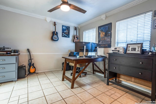 home office with crown molding, ceiling fan, and light tile patterned floors