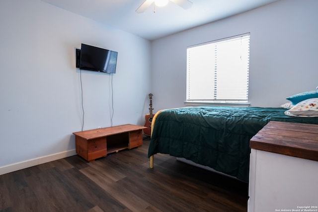 bedroom with dark wood-type flooring and ceiling fan