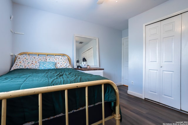 bedroom with dark hardwood / wood-style floors and ceiling fan