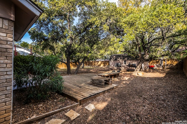 view of yard featuring a wooden deck