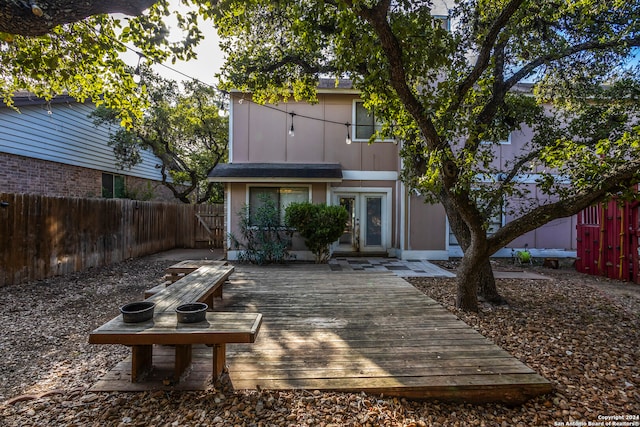 rear view of house with a wooden deck