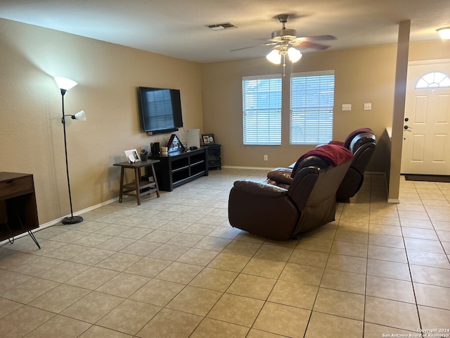 living room with light tile patterned flooring and ceiling fan