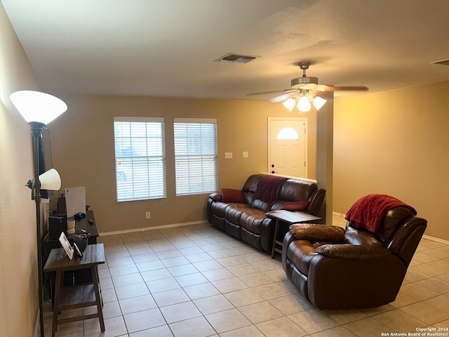 living room with light tile patterned floors and ceiling fan