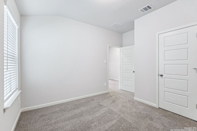 unfurnished bedroom with light carpet