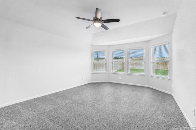 unfurnished room featuring lofted ceiling, carpet flooring, and ceiling fan