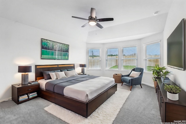 carpeted bedroom featuring ceiling fan and lofted ceiling