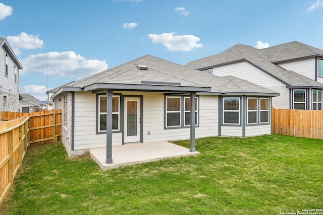 back of property featuring a yard and a patio area