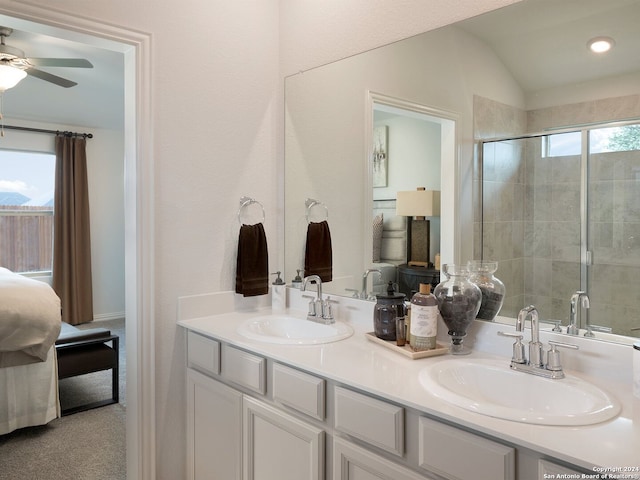 bathroom featuring walk in shower, ceiling fan, lofted ceiling, and vanity