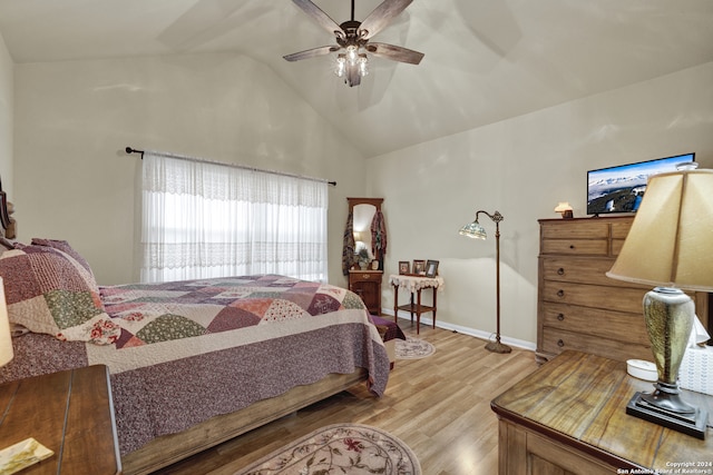 bedroom featuring vaulted ceiling, hardwood / wood-style flooring, and ceiling fan