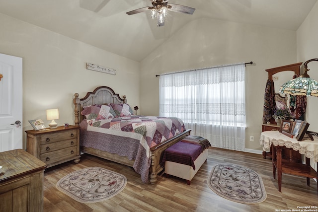 bedroom featuring high vaulted ceiling, wood-type flooring, and ceiling fan