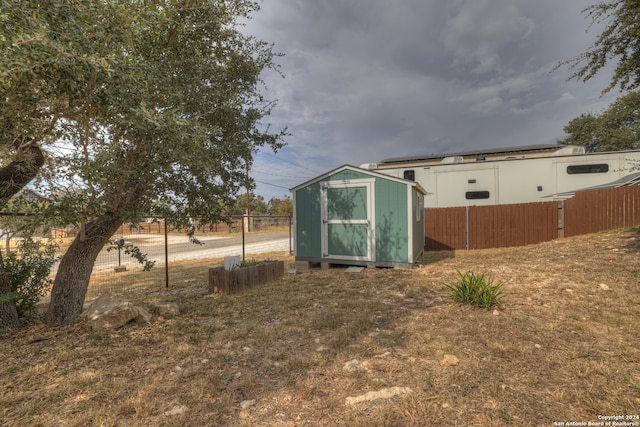 exterior space with a storage shed