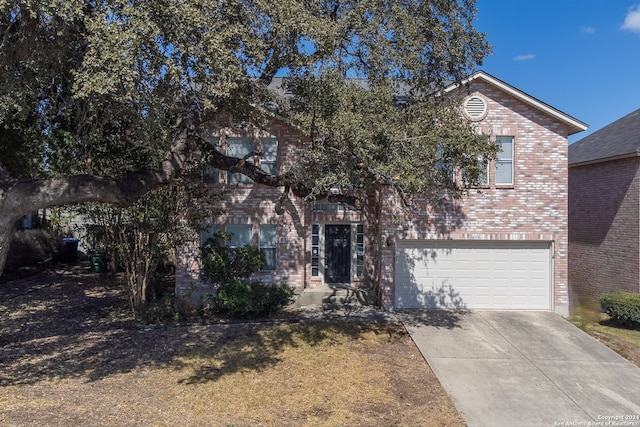 obstructed view of property featuring a garage