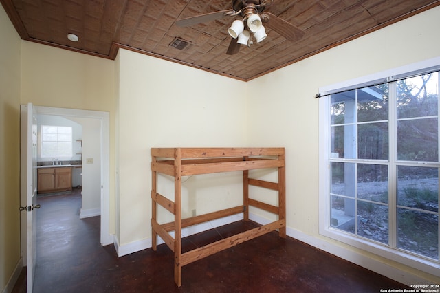 unfurnished bedroom featuring ceiling fan, wood ceiling, and crown molding